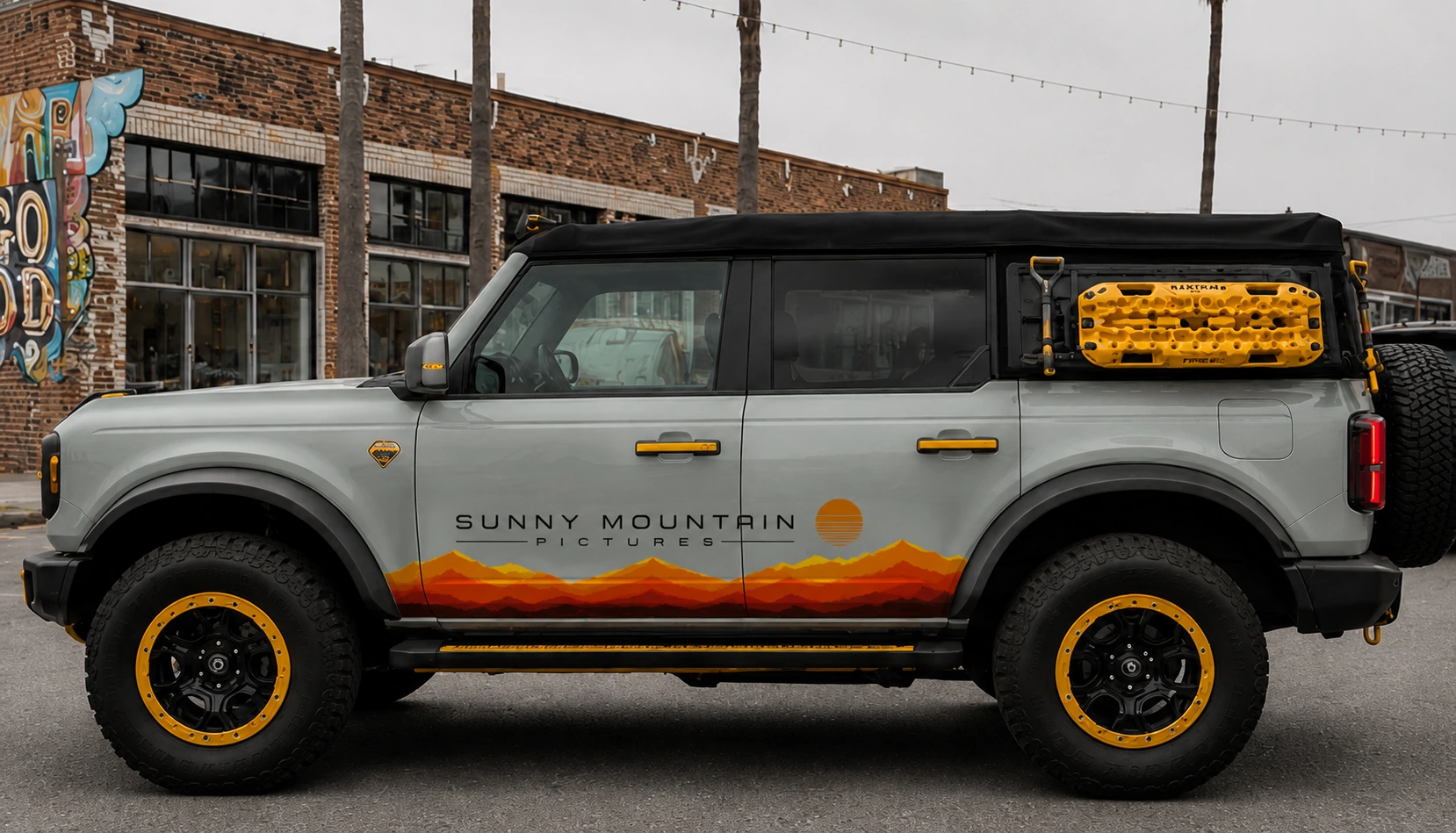 Sunny Mountain Pictures concept Ford Bronco with orange mountain graphics and yellow wheel accents