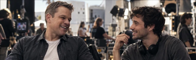 Chase beside a movie-star character on set